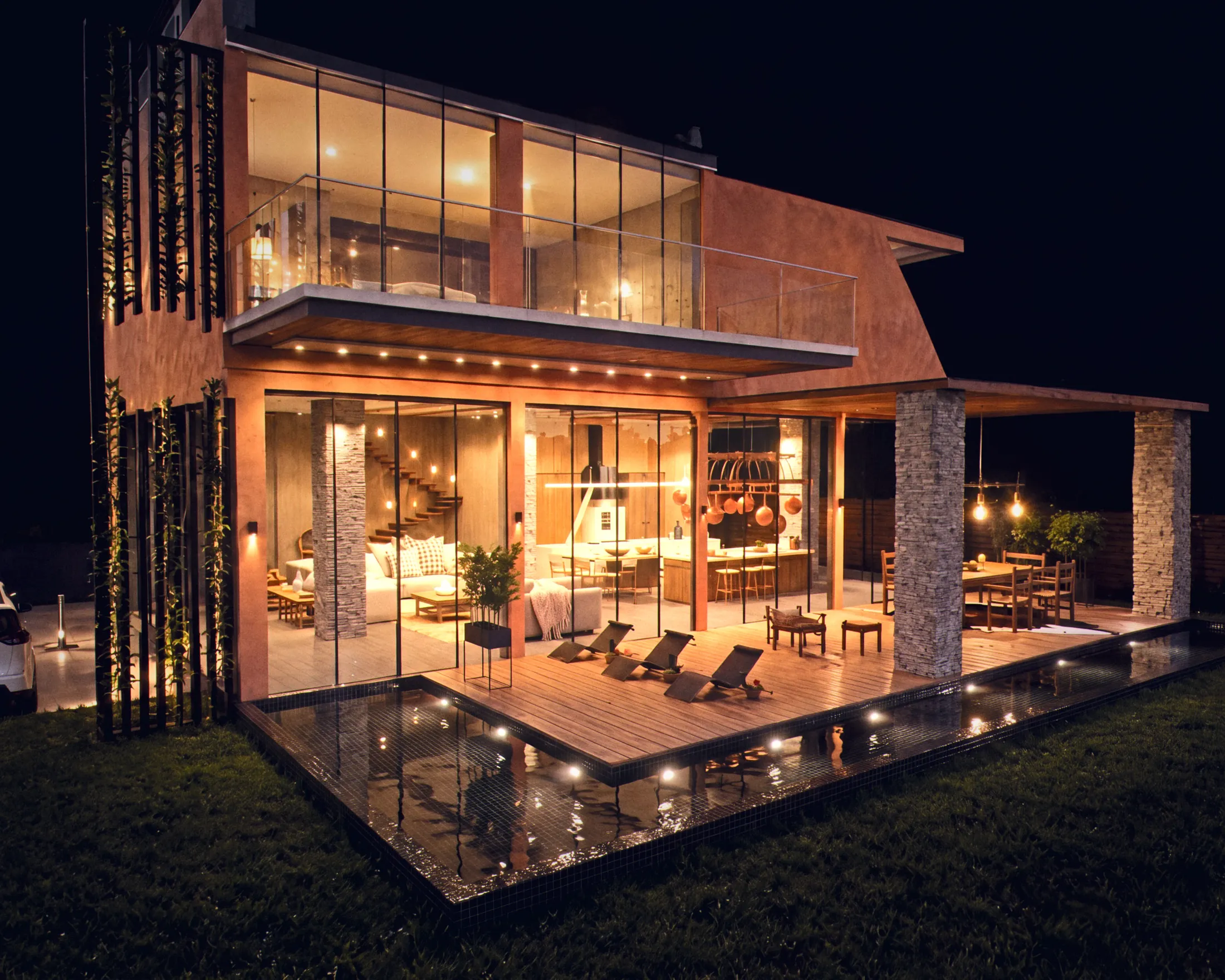 Vineyard house at night with a black mosaic pool
