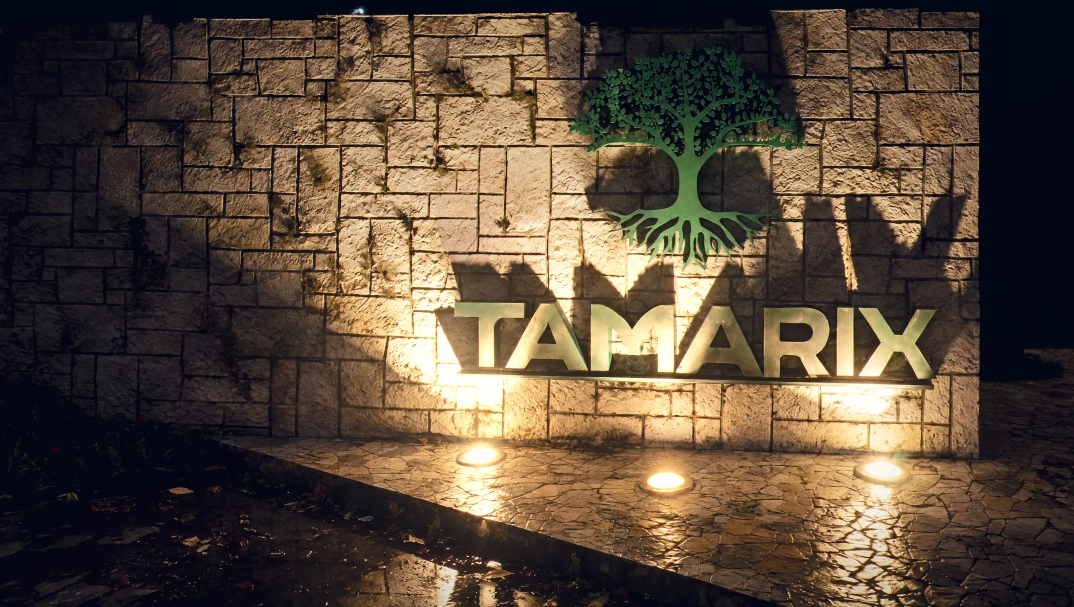 Stone wall with the Tamarix sign